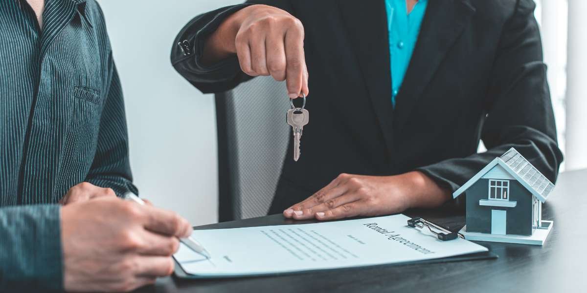 A landlord signing a rental agreement next to a model house while a corporate property consultant holds out a set of keys, illustrating the benefits of switching to a limited company.