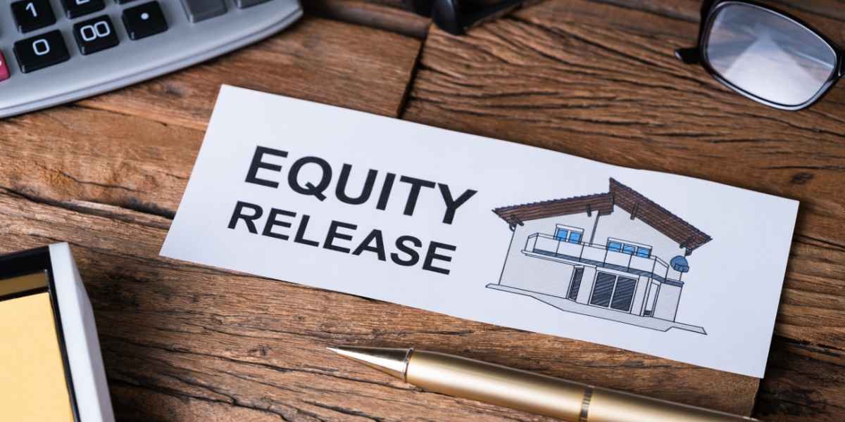 A card reading "Equity Release" next to a drawing of a house on a wooden desk, surrounded by a calculator, a pen, and eyeglasses, illustrating a UK property wealth guide.